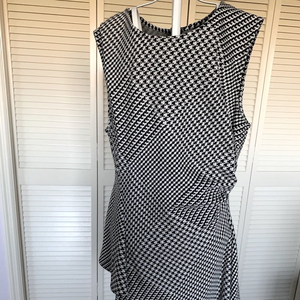 A fun black and white top Goes great with a skirt or slacks
